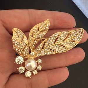 Gold with rhinestone brooch